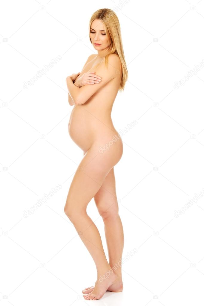 Pregnant woman covering her breast