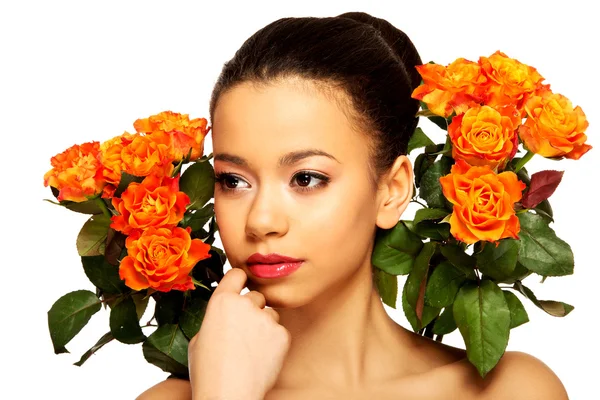 Beauty african woman with roses. — Stock Photo, Image