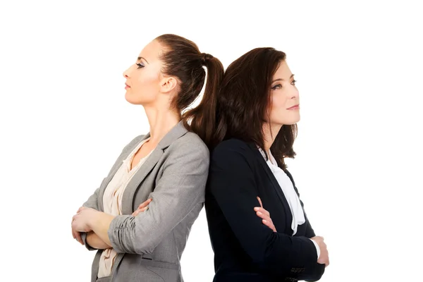 Two businesswoman leaning on each other. — Stock Photo, Image