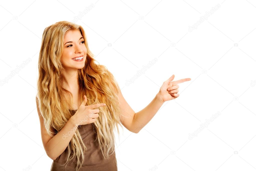 Student woman pointing to the right