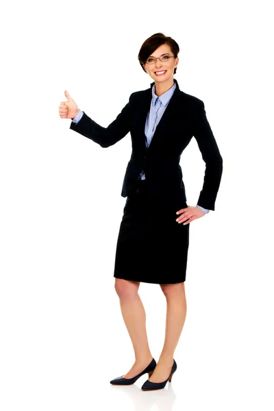 Smiling businesswoman with thumbs up. — Stock Photo, Image