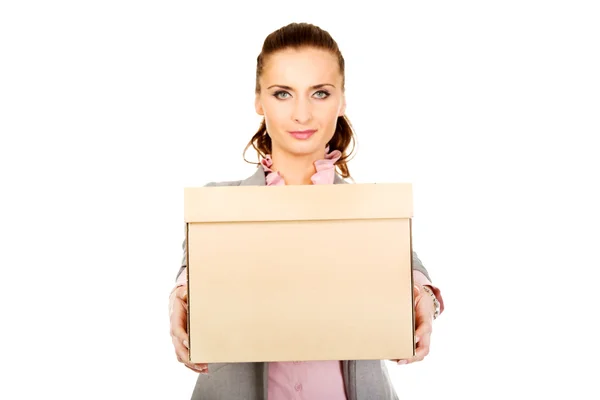 Sad businesswoman carrying box. — Stock Photo, Image