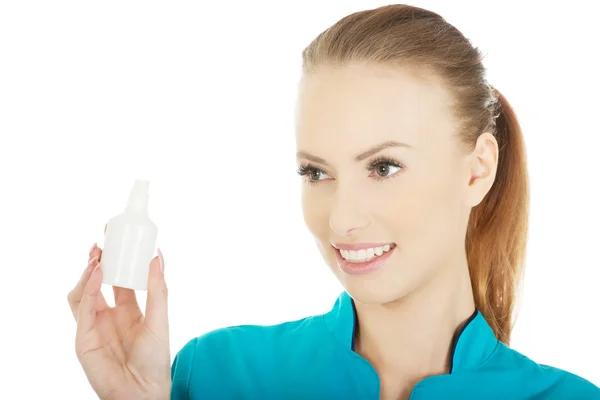 Nurse in uniform with hydrogen peroxide. — Stock Photo, Image