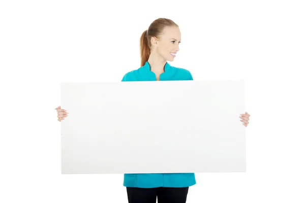 Female doctor holding placard. — Stock Photo, Image