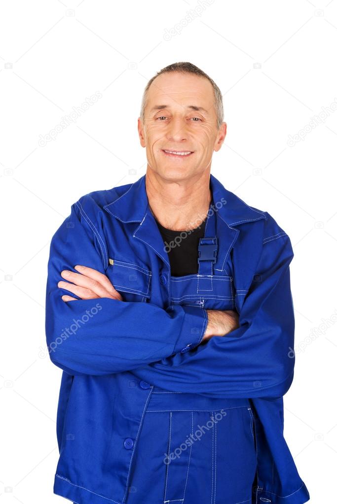 Smiling repairman with folded arms