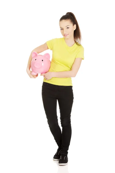 Happy woman holding piggybank. — Stock Photo, Image