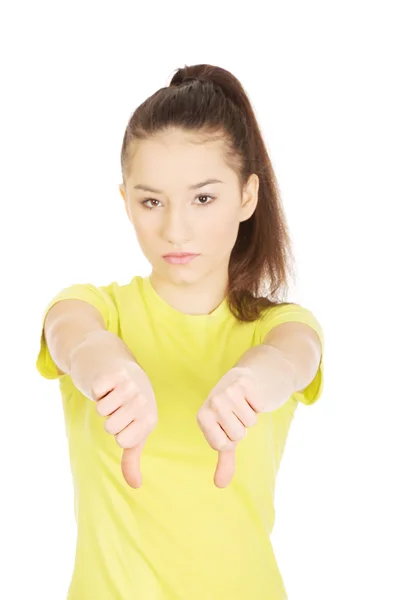 Ongelukkig vrouw met duim omlaag. — Stockfoto