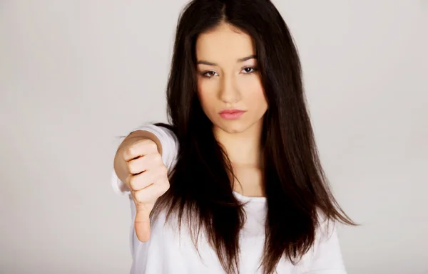 Unhappy woman with thumbs down. — Stock Photo, Image