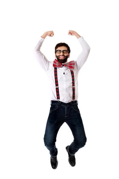 Old fashioned man wearing suspenders jumping. — Stock Photo, Image