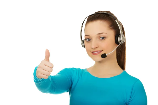 Callcenter-Betreiberin mit erhobenem Daumen. — Stockfoto