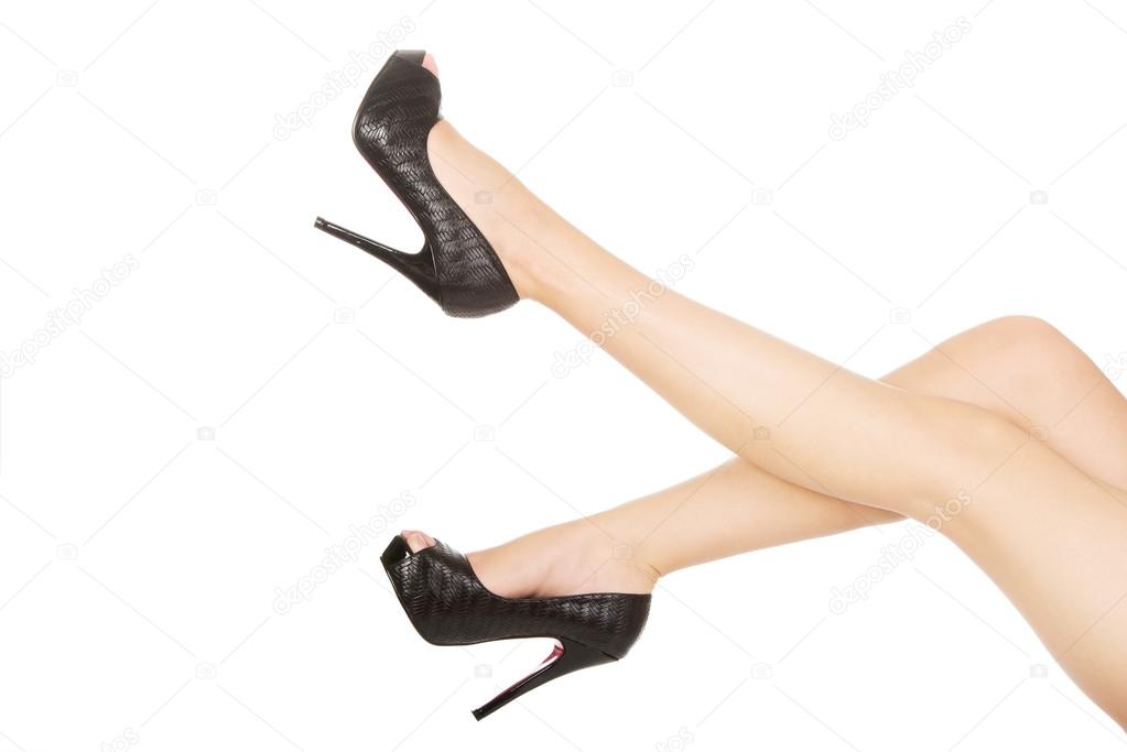 Woman legs with high heels.