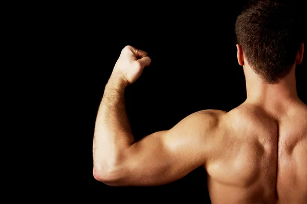 Sexy muscolare uomo mostrando la sua muscolare indietro . — Foto Stock