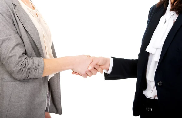 Zwei Frauen im Büro-Outfit geben Handschlag. — Stockfoto