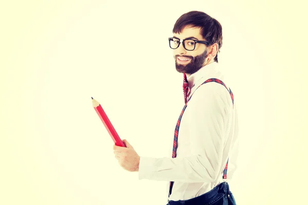 Homem à moda antiga apontando com lápis grande . — Fotografia de Stock