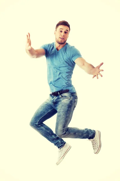 Handsome man jumping for joy. — Stock Photo, Image