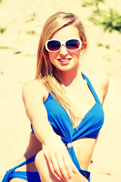 Young woman in a blue swimsuit — Stock Photo, Image