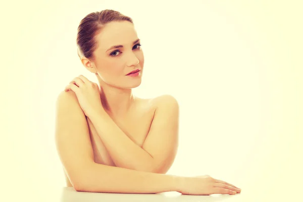 Beautiful young spa woman by a desk. — Stock Photo, Image