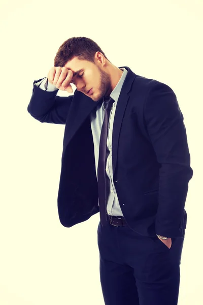 Worried businessman touching his forehead. — Stock Photo, Image