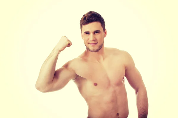 Young athletic man showing his muscles. — Stock Photo, Image