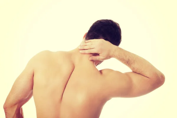 Athletic man feeling pain in his neck. — Stock Photo, Image