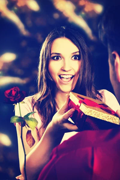 Woman recieving a gift. — Stock Photo, Image