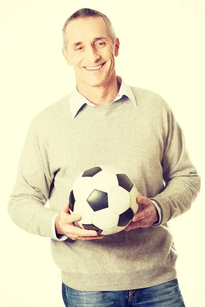 Mature man with a soccer ball — Stock Photo, Image