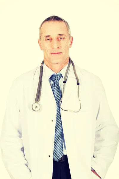 Confident male doctor with his hands in pockets — Stock Photo, Image