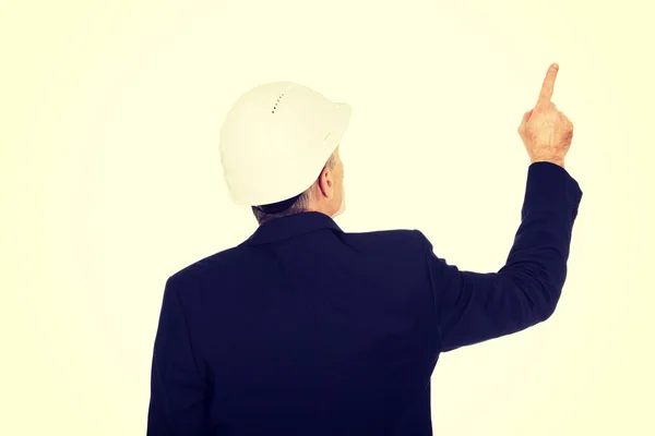 Biznesmen z twardy kapelusz skierowana w górę — Zdjęcie stockowe