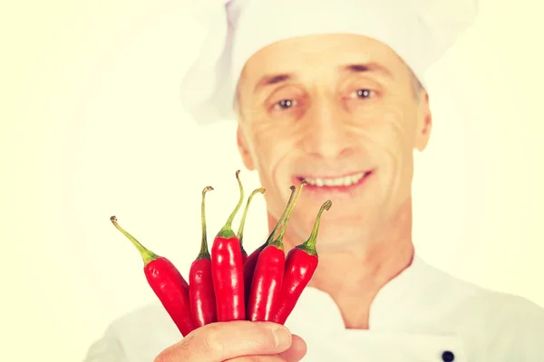 Male chef with chilli peppers — Stock Photo, Image