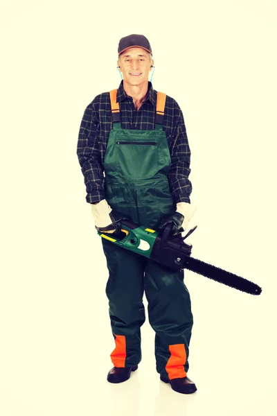 Adult sawyer with chainsaw — Stock Photo, Image