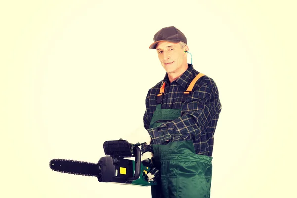 Adult sawyer with chainsaw — Stock Photo, Image