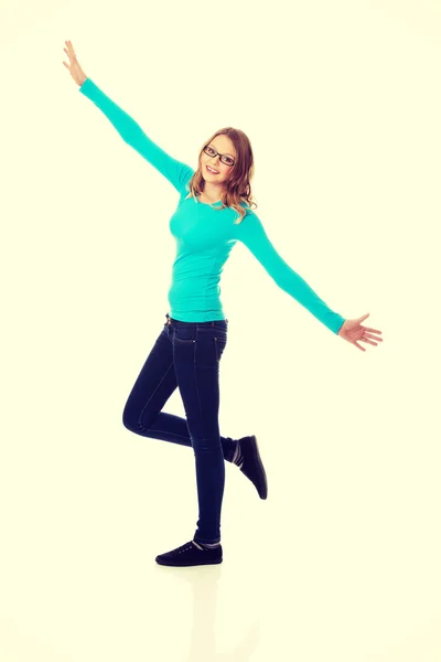 Happy teenage woman with arms wide open — Stock Photo, Image