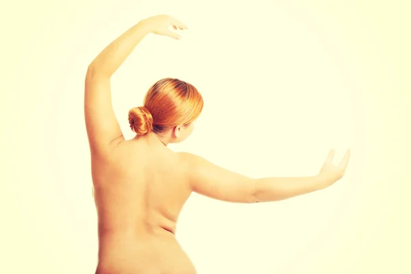 Şişman üstsüz kadın kollarını ile gergin — Stok fotoğraf