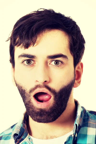 Young shocked man with mouth open. — Stock Photo, Image