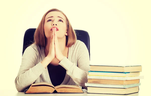 Woman praying to pass the exam — Stock Photo, Image