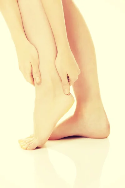 Woman massaging her foot — Stock Photo, Image