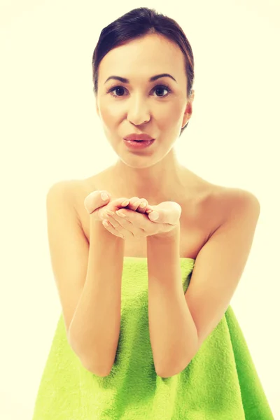 Beautiful woman blowing a kiss to somebody — Stock Photo, Image