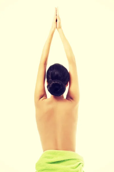 Woman sitting stretching arms above her — Stock Photo, Image