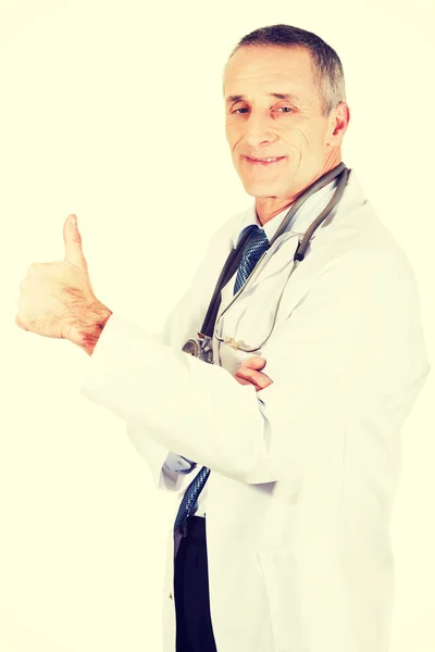 Mature male doctor with thumb up — Stock Photo, Image