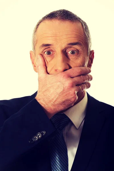 Ritratto di uomo d'affari che copre la bocca — Foto Stock