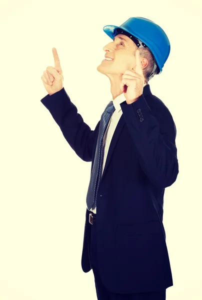 Businessman engineer pointing up — Stock Photo, Image