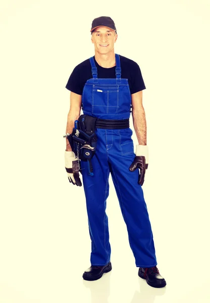 Full length mature worker with tool belt — Stock Photo, Image