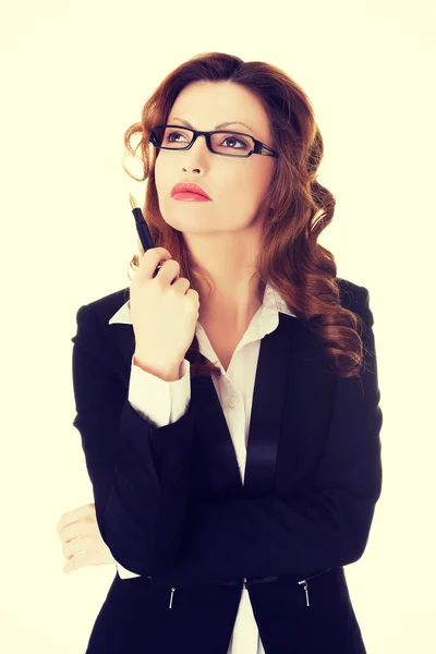 Thinking business woman looking up. — Stock Photo, Image