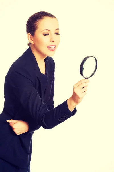 Businesswoman with magnifying glass. — Stock Photo, Image