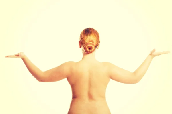 Kövér félmeztelen nőt, gazdaság valamit a kezében — Stock Fotó