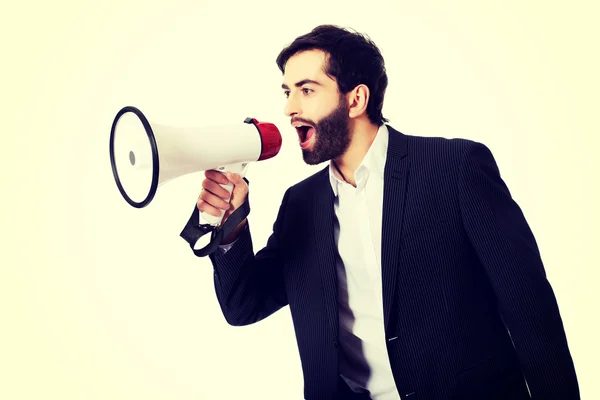 Empresário gritando usando um megafone . — Fotografia de Stock