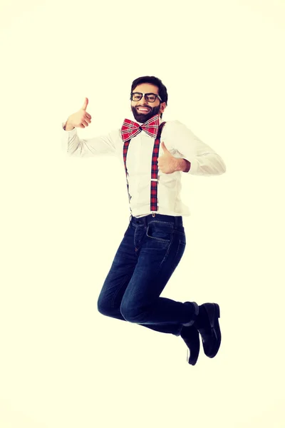 Old fashioned man wearing suspenders jumping. — Stock Photo, Image