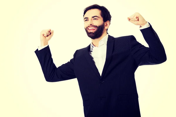 Businessman making fists in a winner gesture. — Stock Photo, Image