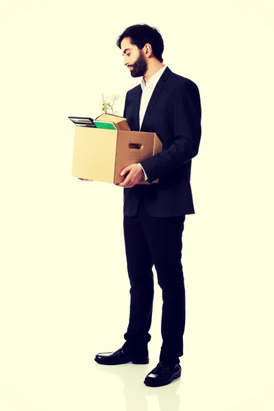 Businessman holding box with personal belongings. — Stock Photo, Image