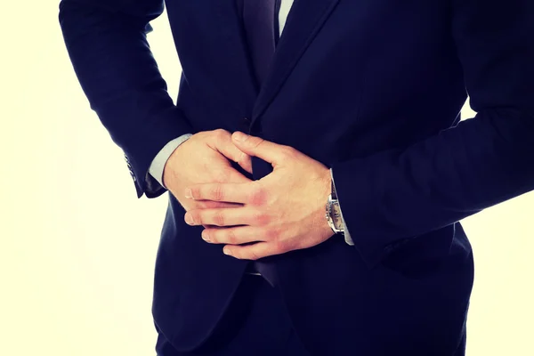 Businessman suffering from stomach pain. — Stock Photo, Image